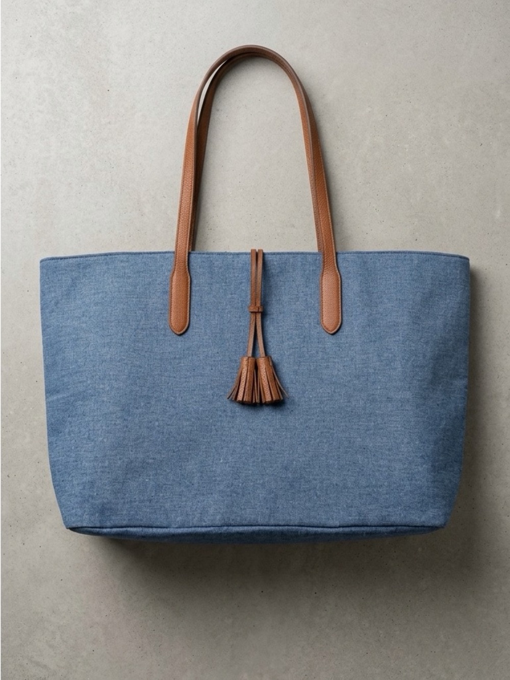 Blue Canvas Tote with Brown Leather Handles and Tassel Accent